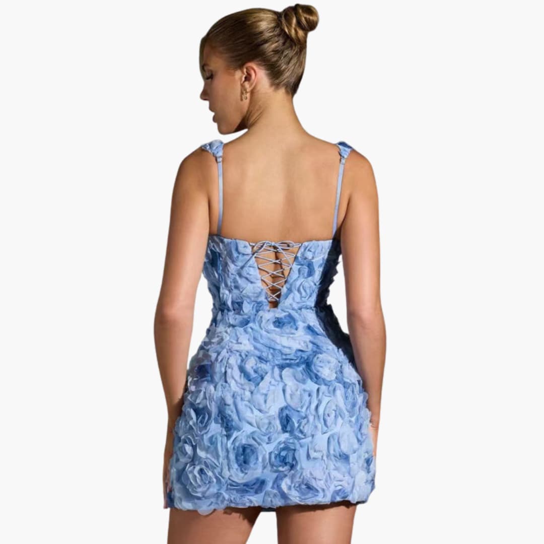 Women’s mini dress with sleeveless design and floral appliqué