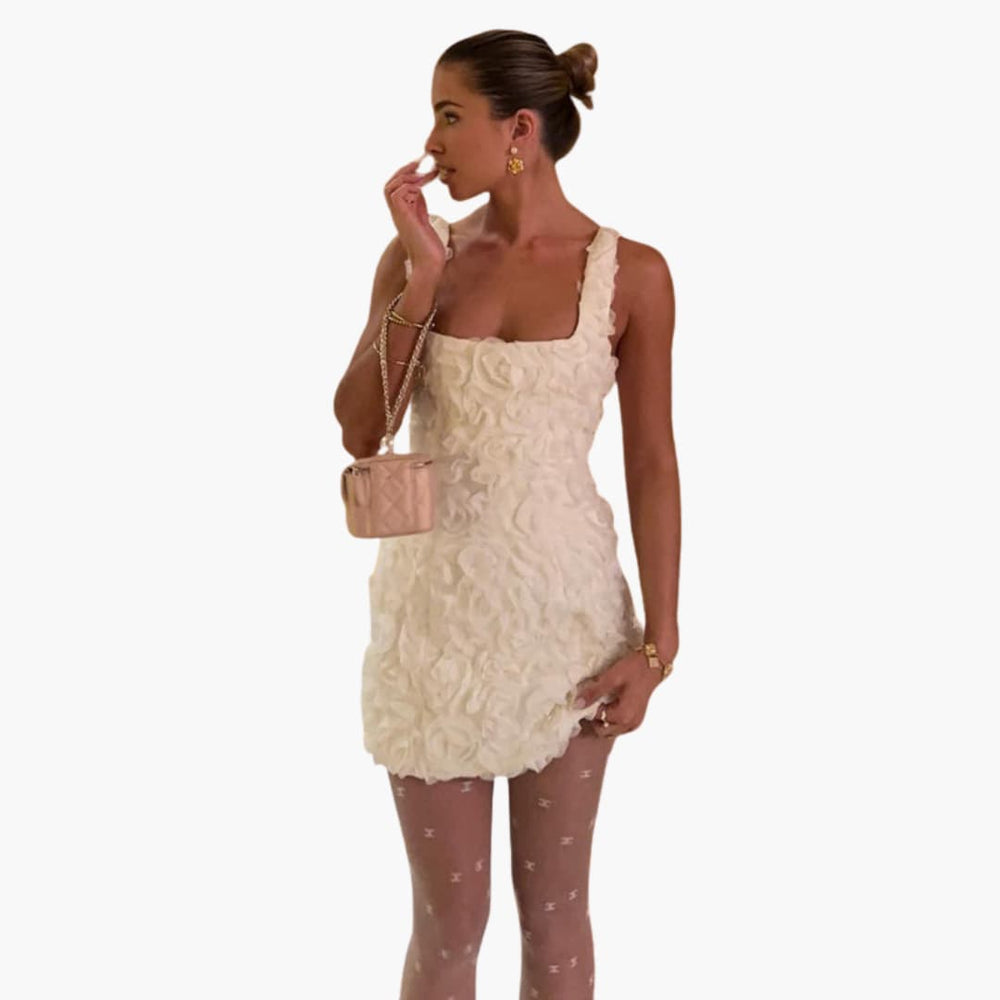 Women’s mini dress with sleeveless design and floral appliqué