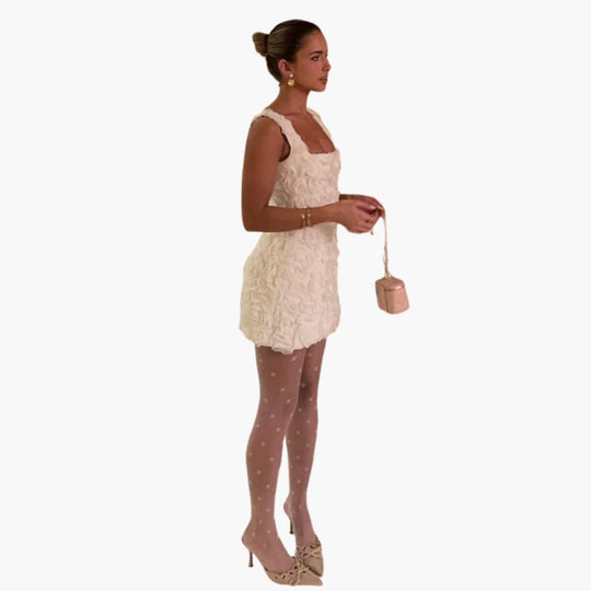 Women’s mini dress with sleeveless design and floral appliqué