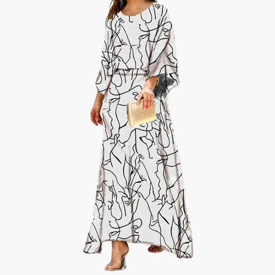Women's Smocked Maxi Dress with Long Sleeves and Vibrant Abstract Print