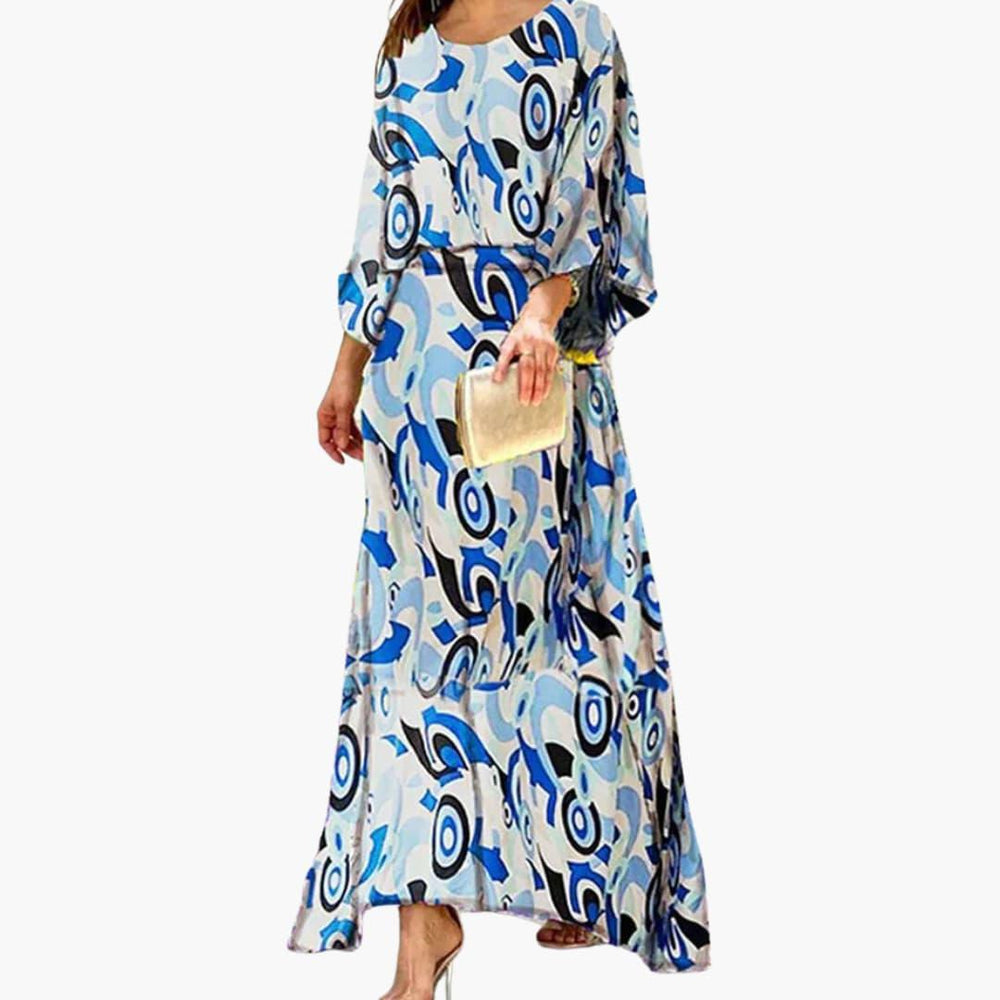 Women's Smocked Maxi Dress with Long Sleeves and Vibrant Abstract Print