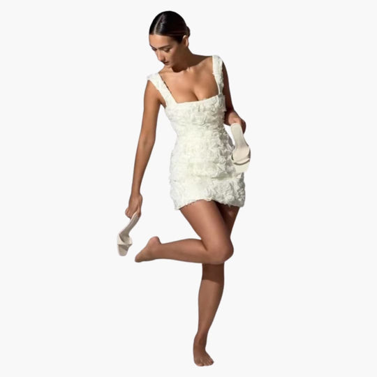 Women’s mini dress with sleeveless design and floral appliqué